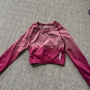 Pink Gymshark cropped long sleeve top